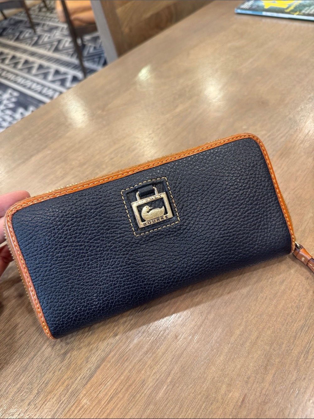 Dooney & Bourke Black Leather Zip Wallet with Tan Trim and Logo Plaque